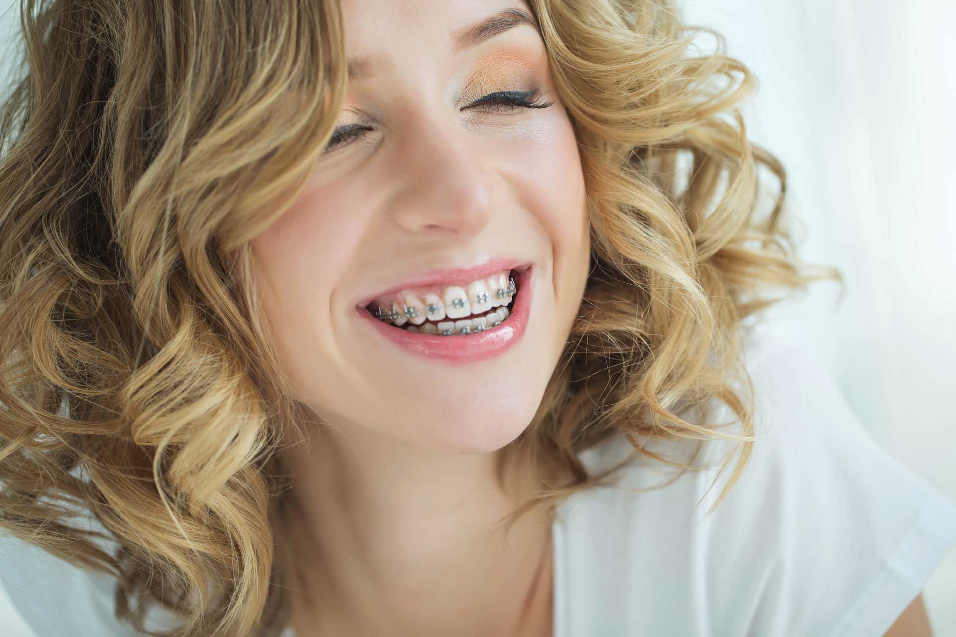 young-woman-with-curly-hair-and-braces.jpg