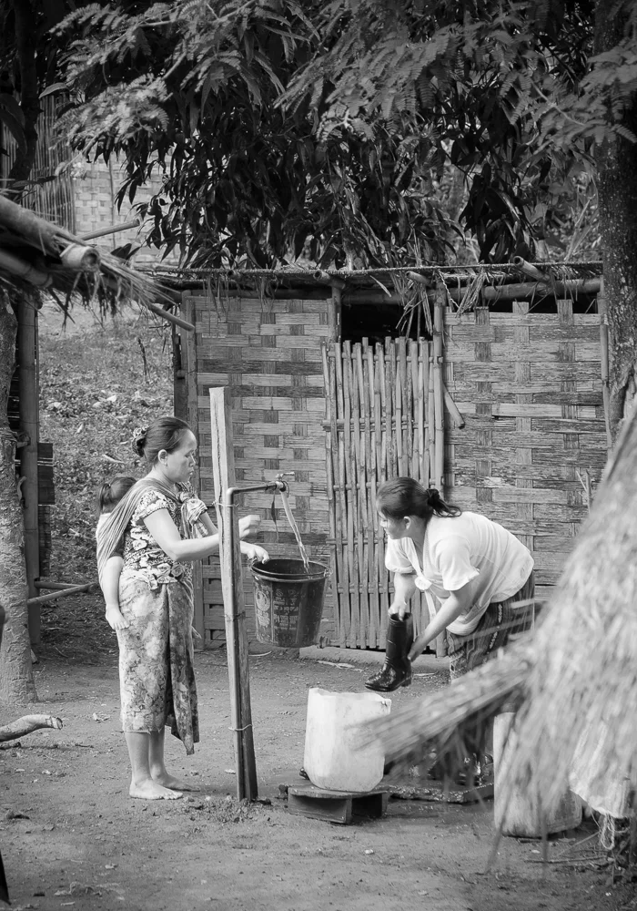 Women at the well Hmong Village, Laos