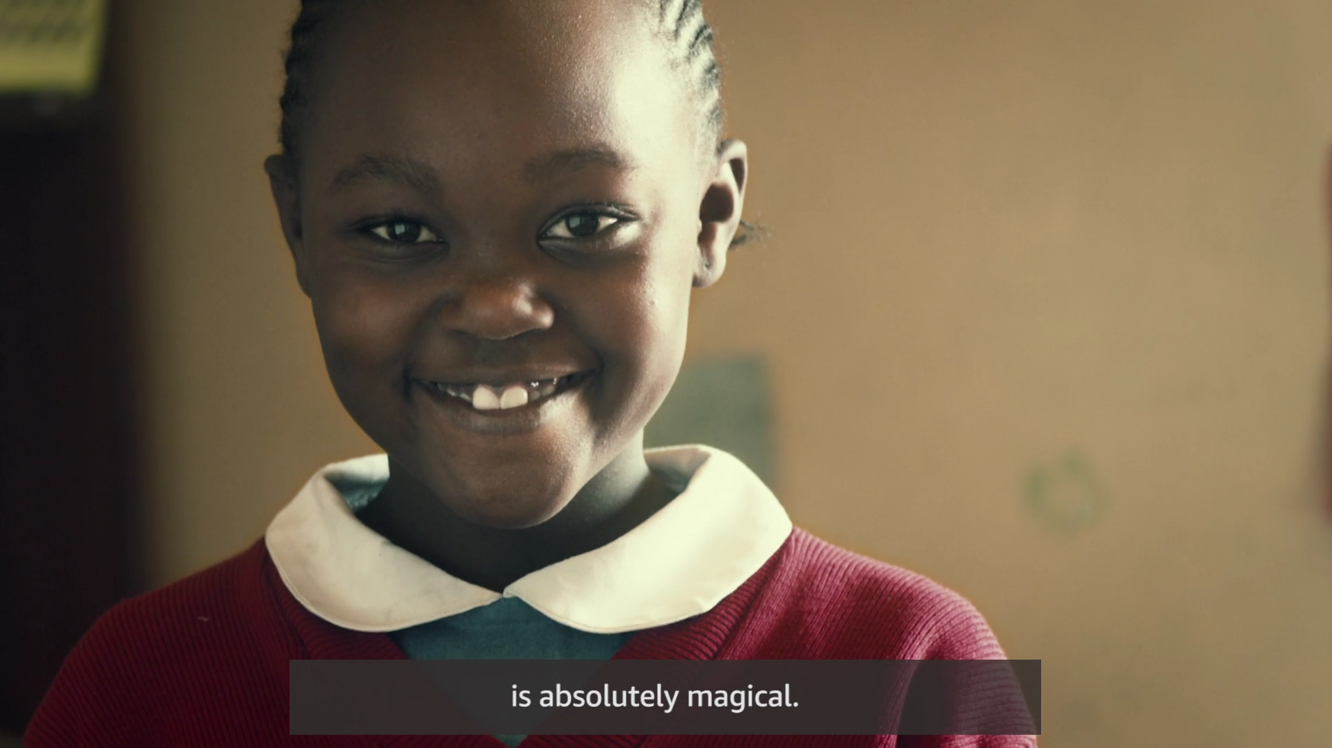 child smiling wearing Christmas colors
