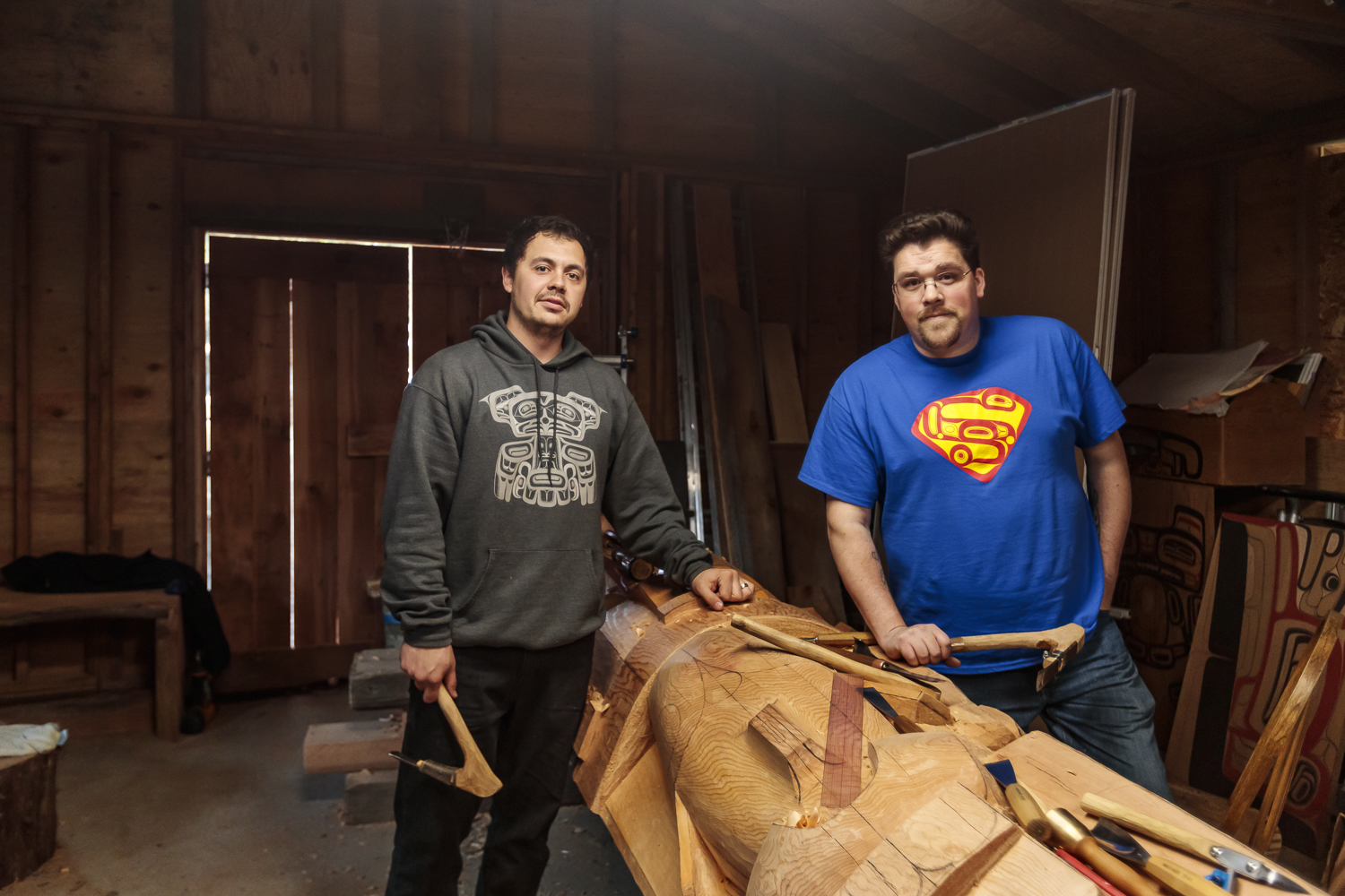 David Robert Boxley (right) and Clifton Guthrie (left) are working on a totem pole for a local non profit in Metlakatla, Alaska. Both David and Clifton create amazing pieces of traditional and non traditional Tsimshian art for communities, galleries…