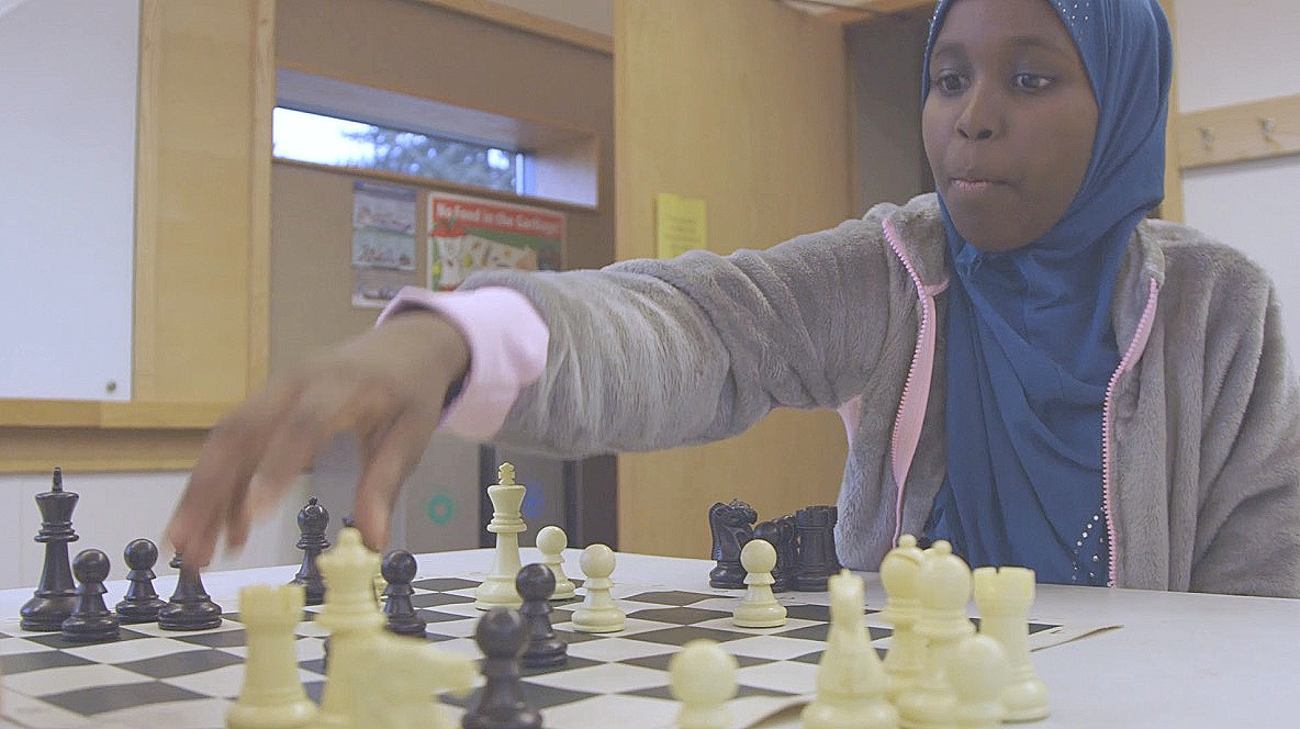 Halima checkmates her opponent in an after school chess program at her local branch of the Seattle Public Library.