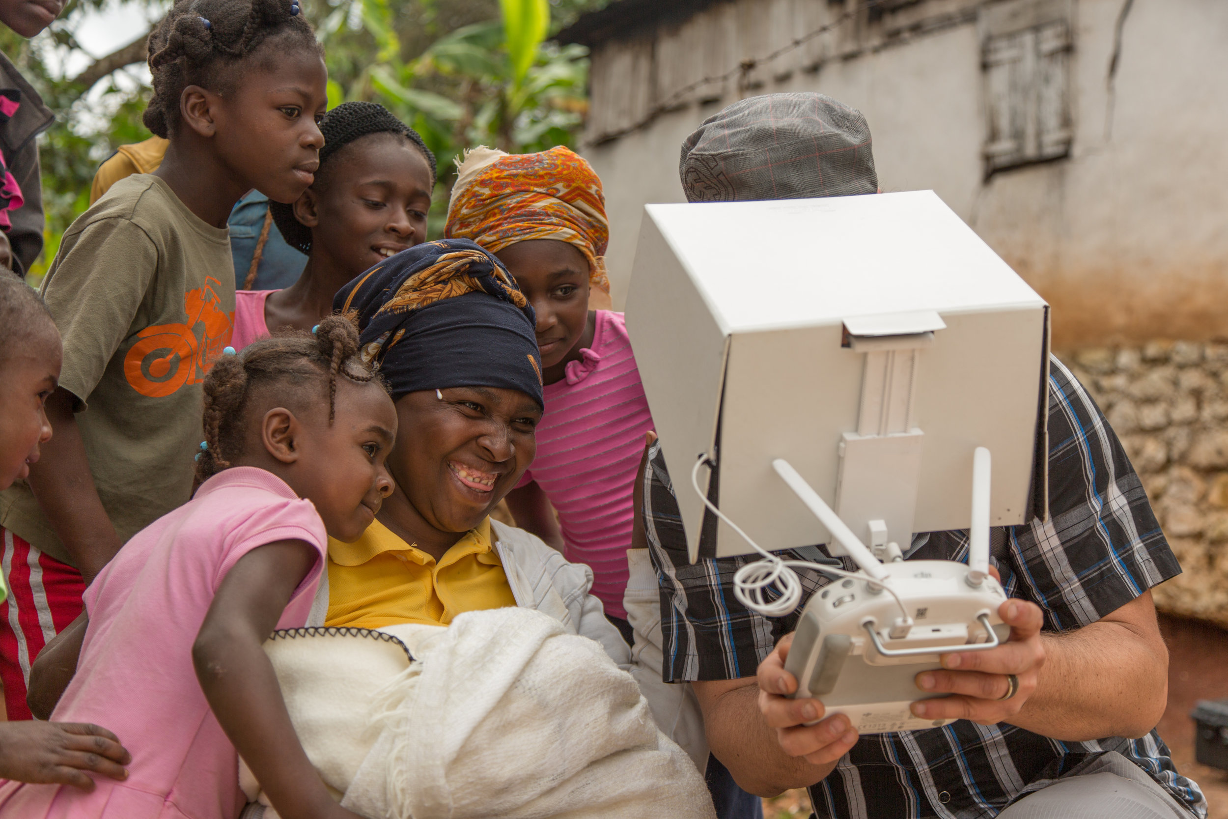 One of the farming families watches Director Aaron Straight fly an early drone over Boukan Chat Haiti. The kindness and sense of humor shared by the community with all the partnering teams (Dominican Republic, Germany, and US) that come to help make…