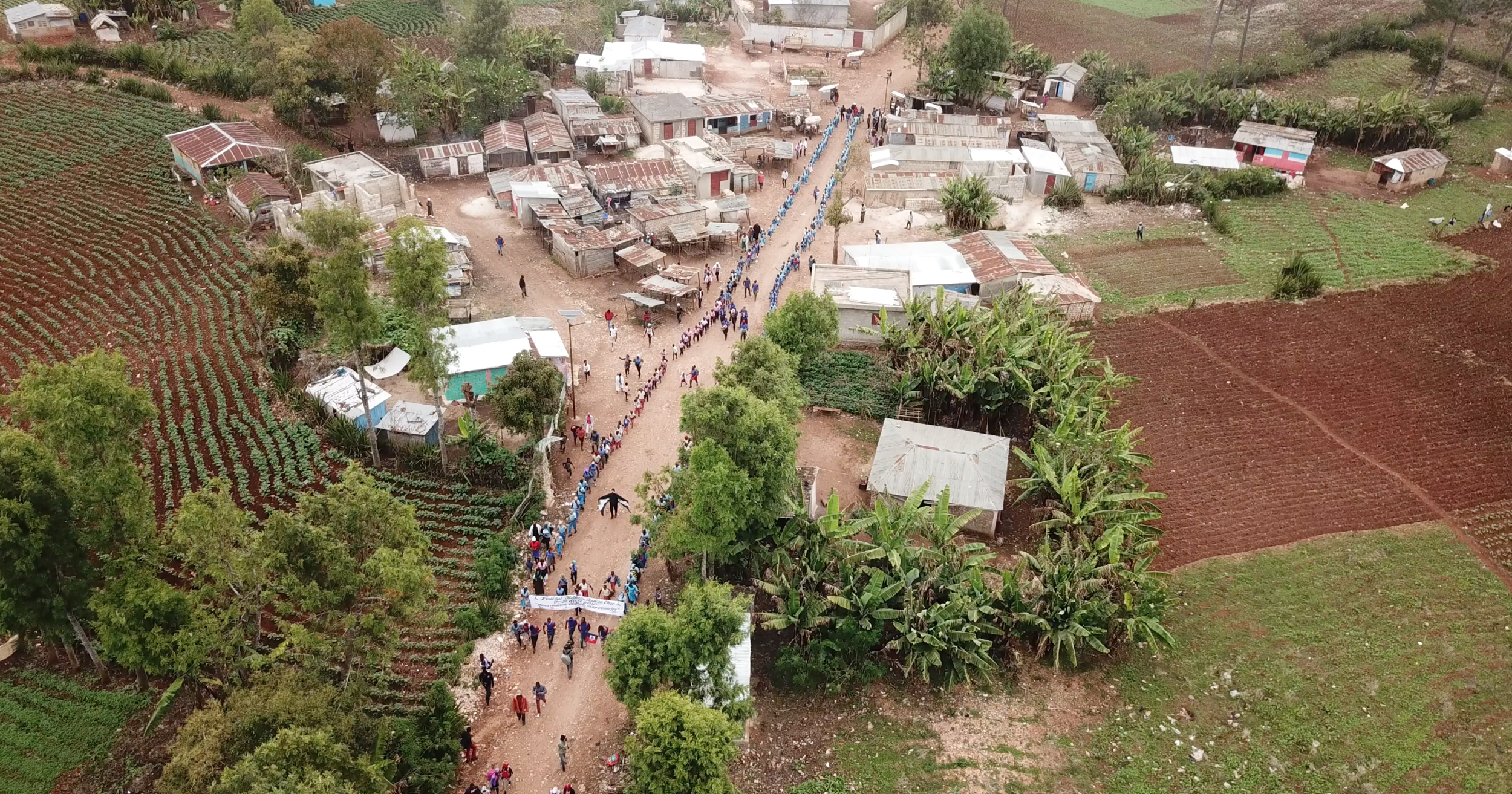 An aerial view of the First Annual Diablotin Festival in Boukan Chat Haiti in 2018. After nearly 7 years of hard work the Diablotin Festival was designed as a celebration of the hard work by the community improving their own lives and protecting the…