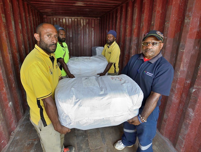 Hela Hospital staff offload Insecticide-treated bed nets which protect against malaria illness.