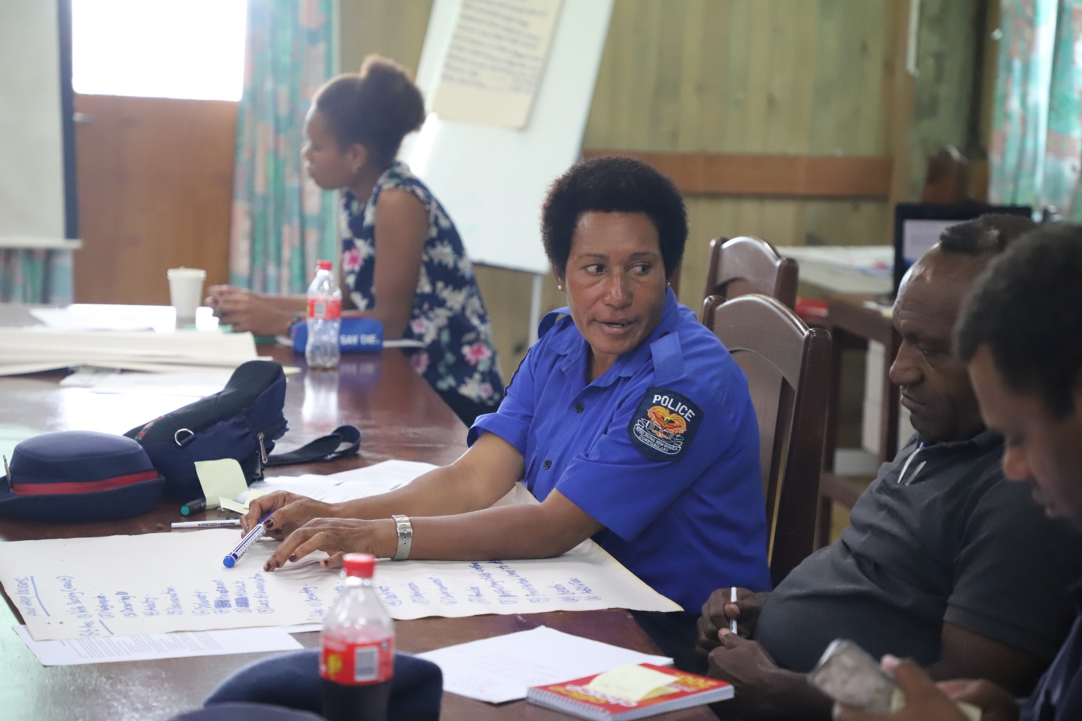 Corporal Christine Luke from the Moro Police Station participates in the group discussion.