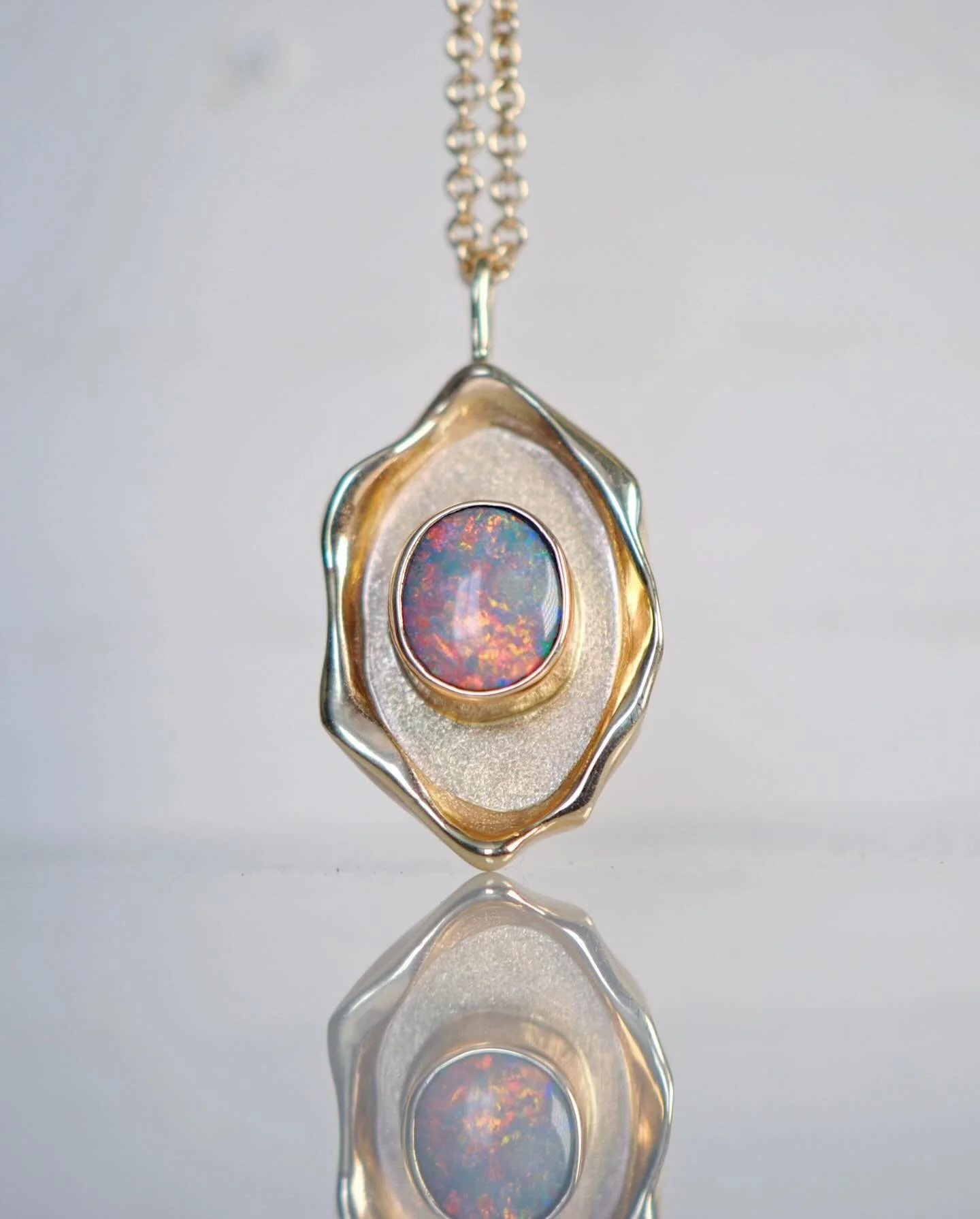 Cosmic Portal Necklace 🪞💫
The most magical piece! Featuring a solid Lighting Ridge Opal from @ancients17opal with a gorgeous sunset color palette. Handcrafted in 14kt gold and available so soon! ✨✨✨
