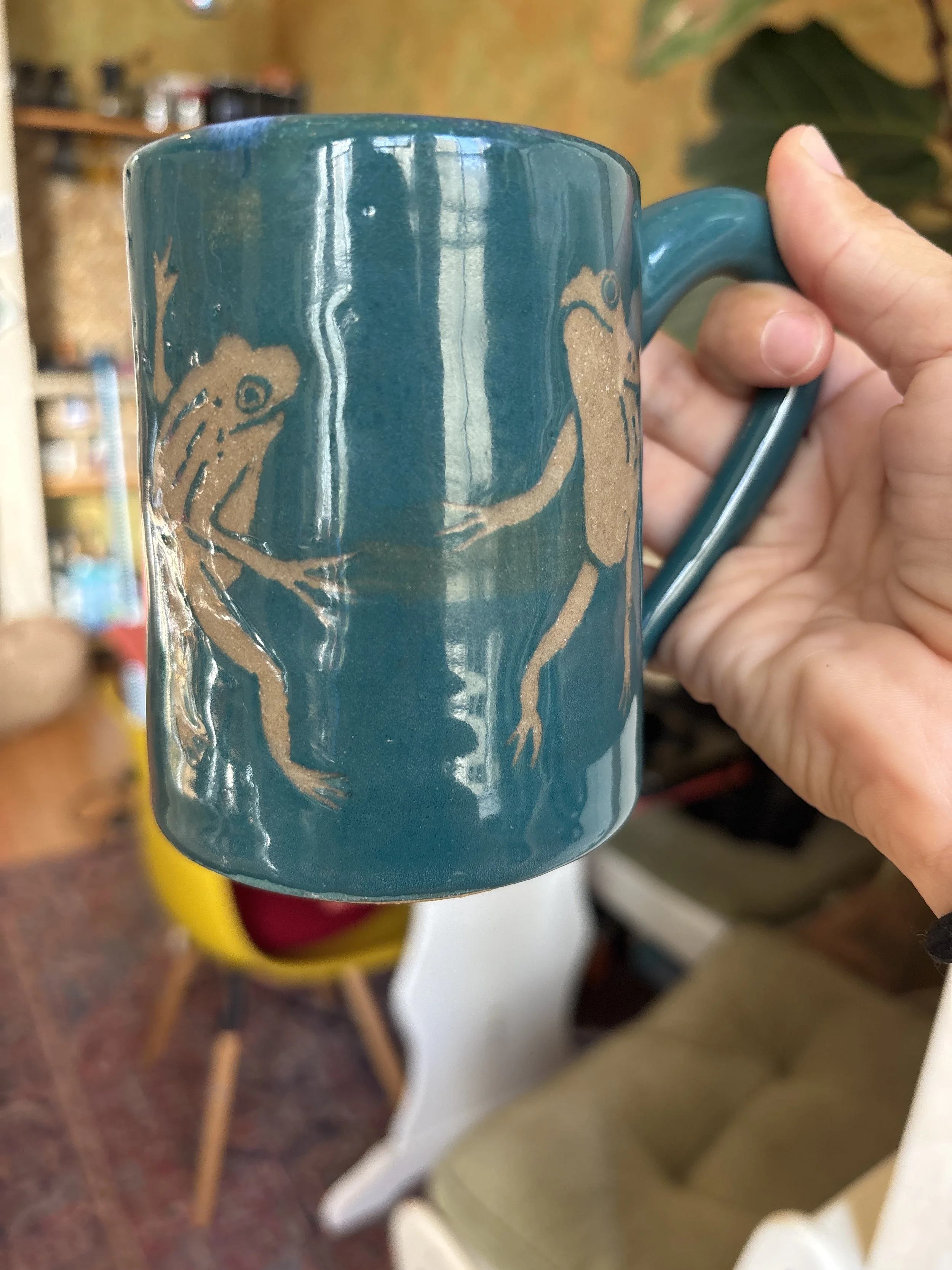   Isobel Nairn    Frog mug   Ceramic with sgraffito   Description:  Frogs are beautiful creatures, and deserve to dance. My mug imagines a world where frogs not only dance, but dance together. 