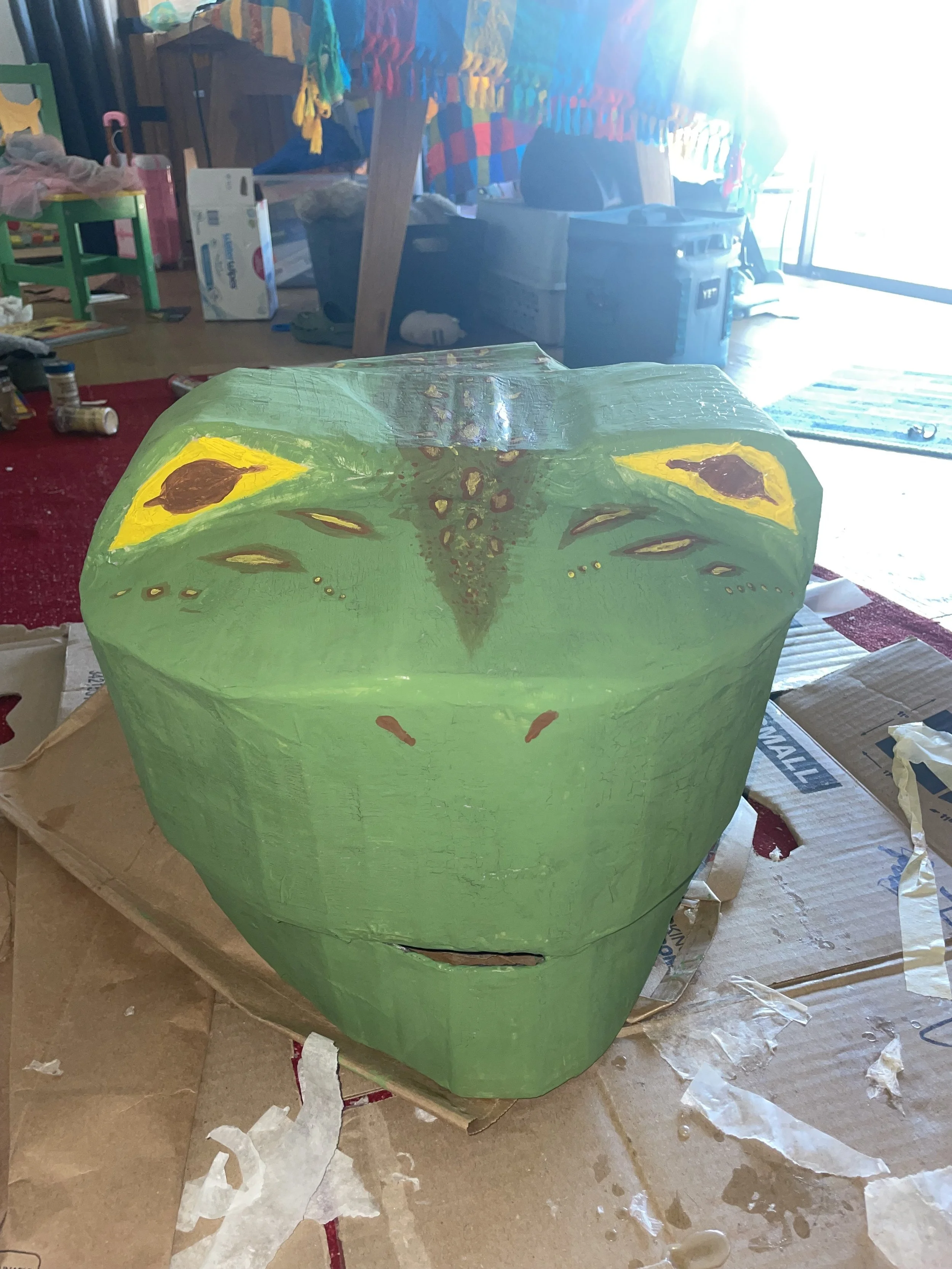   Gravity Emanuel, Kathleen Rosales    Frog Head , 2026  Cardboard, paper mache, acrylic paint 