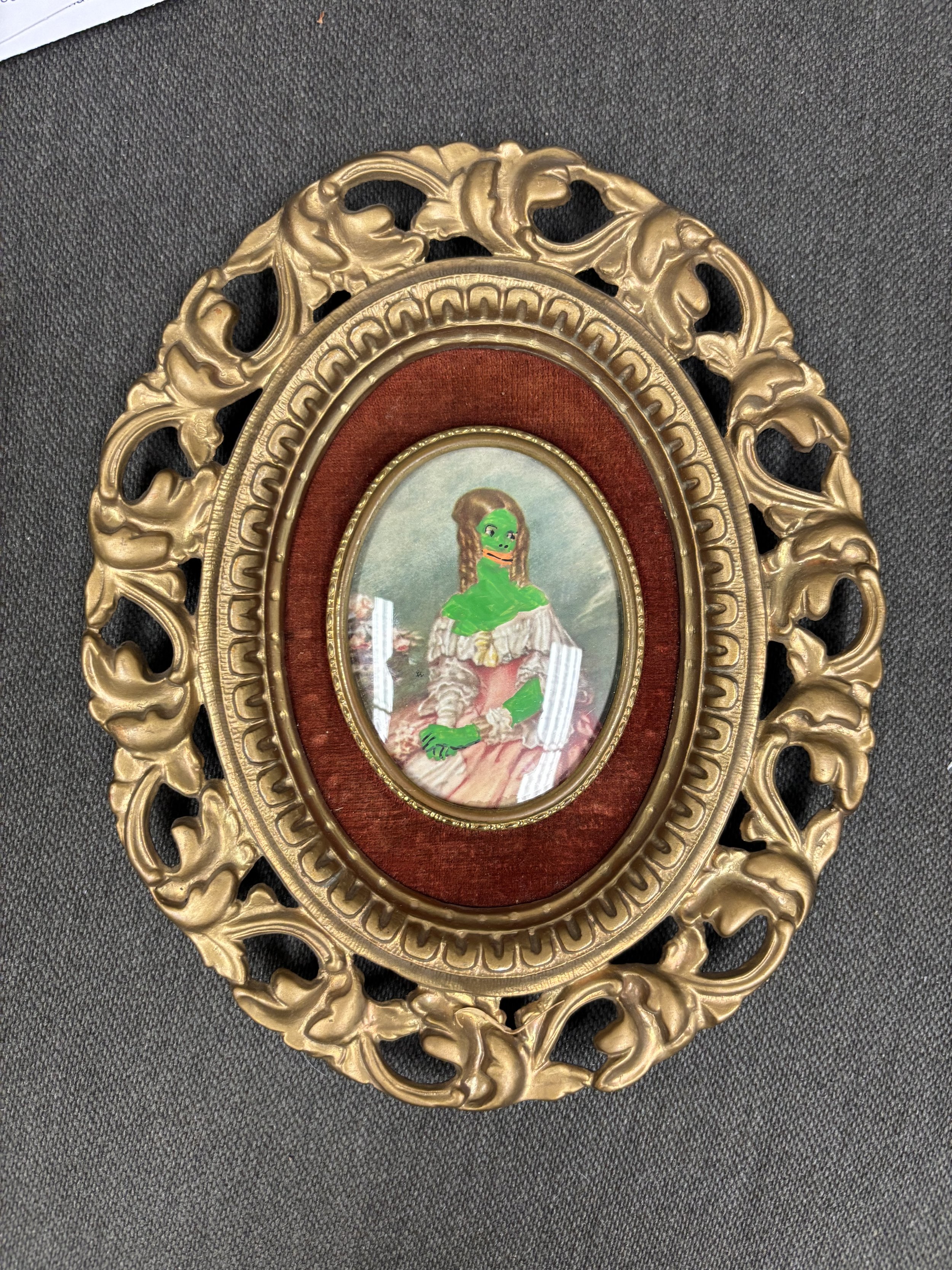   Marko Yamagata    "The Lady Louisa Frogerald".  All were made in August 2026. They fresh.  Acrylic markers on framed print   Description:  These works represent an exploration of the physical flexibility and evolutionary adaptability of frogs taken