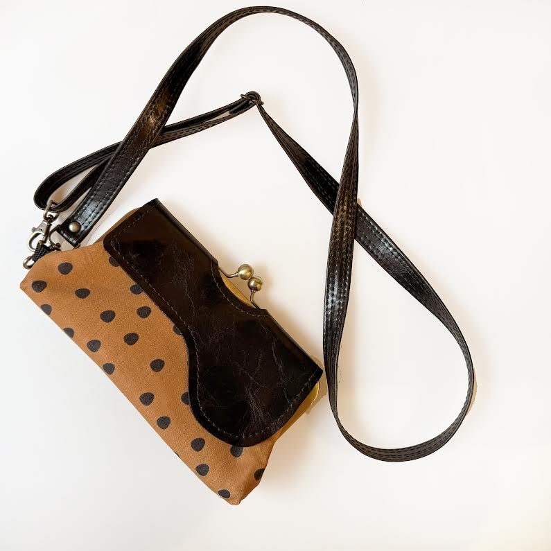 The Audrey Wallet Clutch created with the artists hand drawn textiles and recycled materials. Featuring a cross body strap and wrist strap and interior wallet.