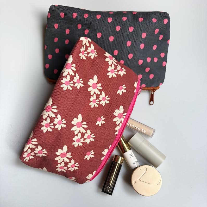 Cotton canvas zipper pouches created with the artists hand drawn textiles.