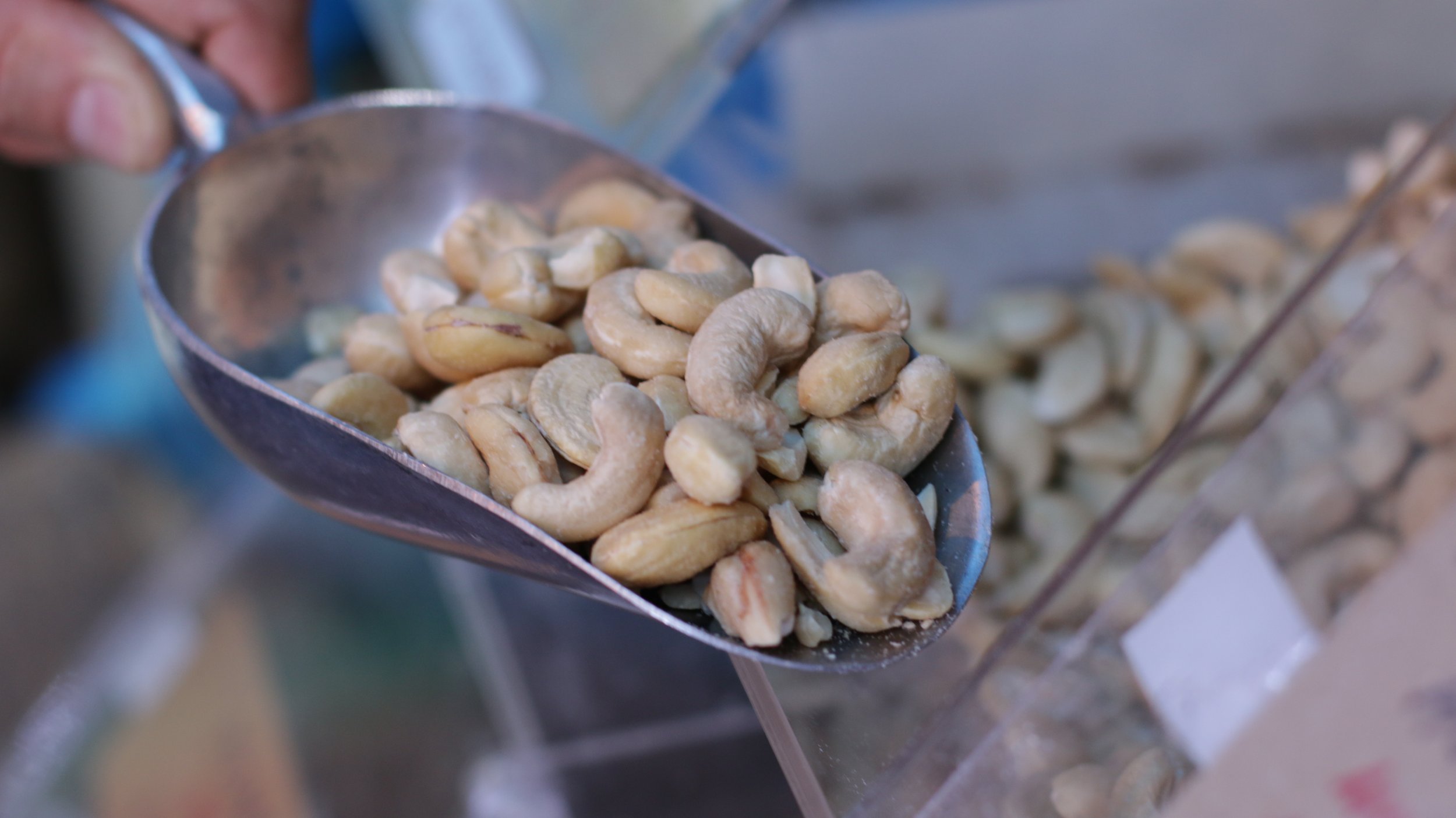 Cashew nuts with scoop close up.JPG