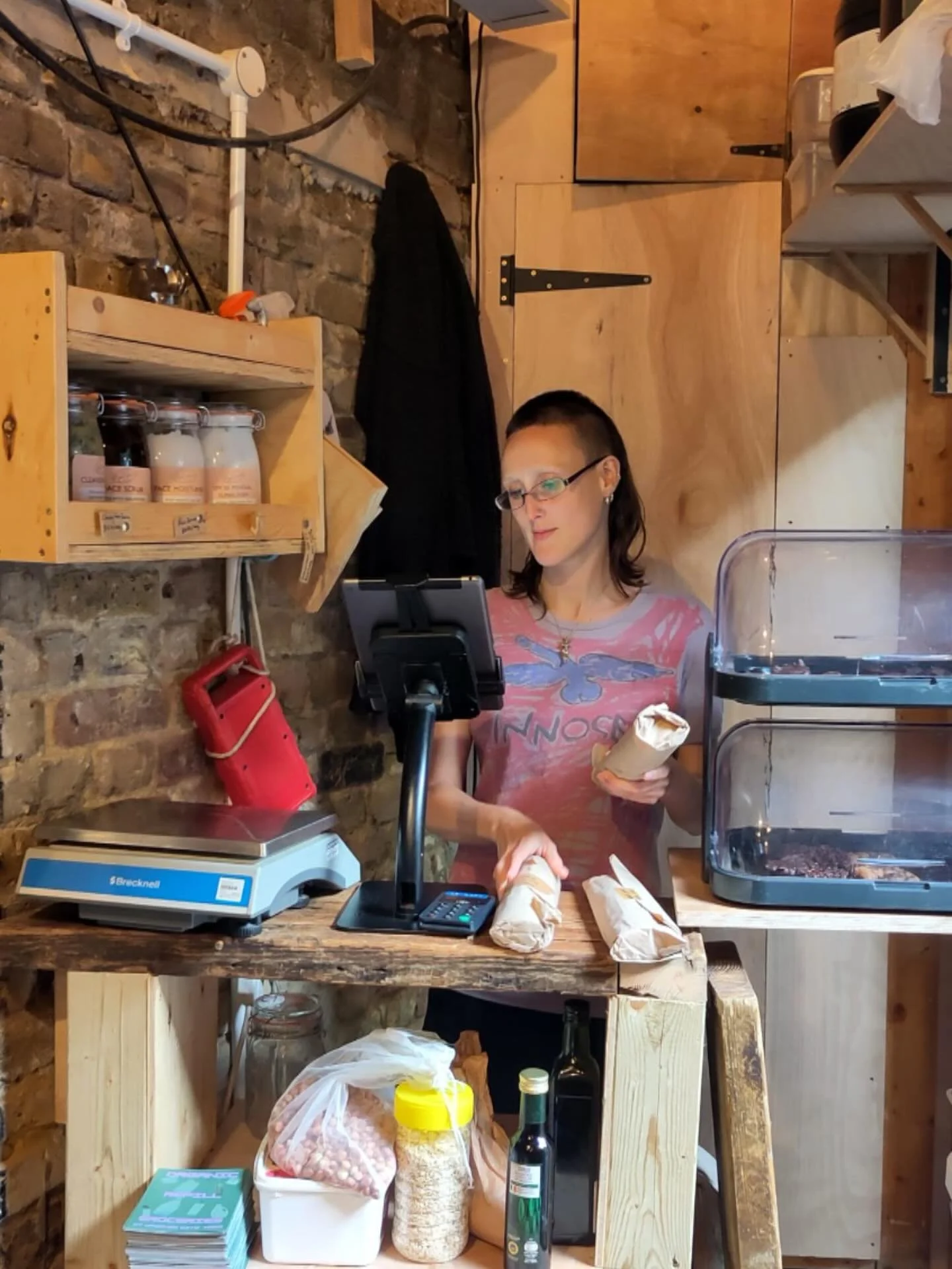 Have you seen our extension progress?
We have a whole new more ergonomic staff / till area to serve you more easily.
Just place your basket, or items, on the lower shelf for the friendly team member (in this case Ellie) to process your shopping.
O