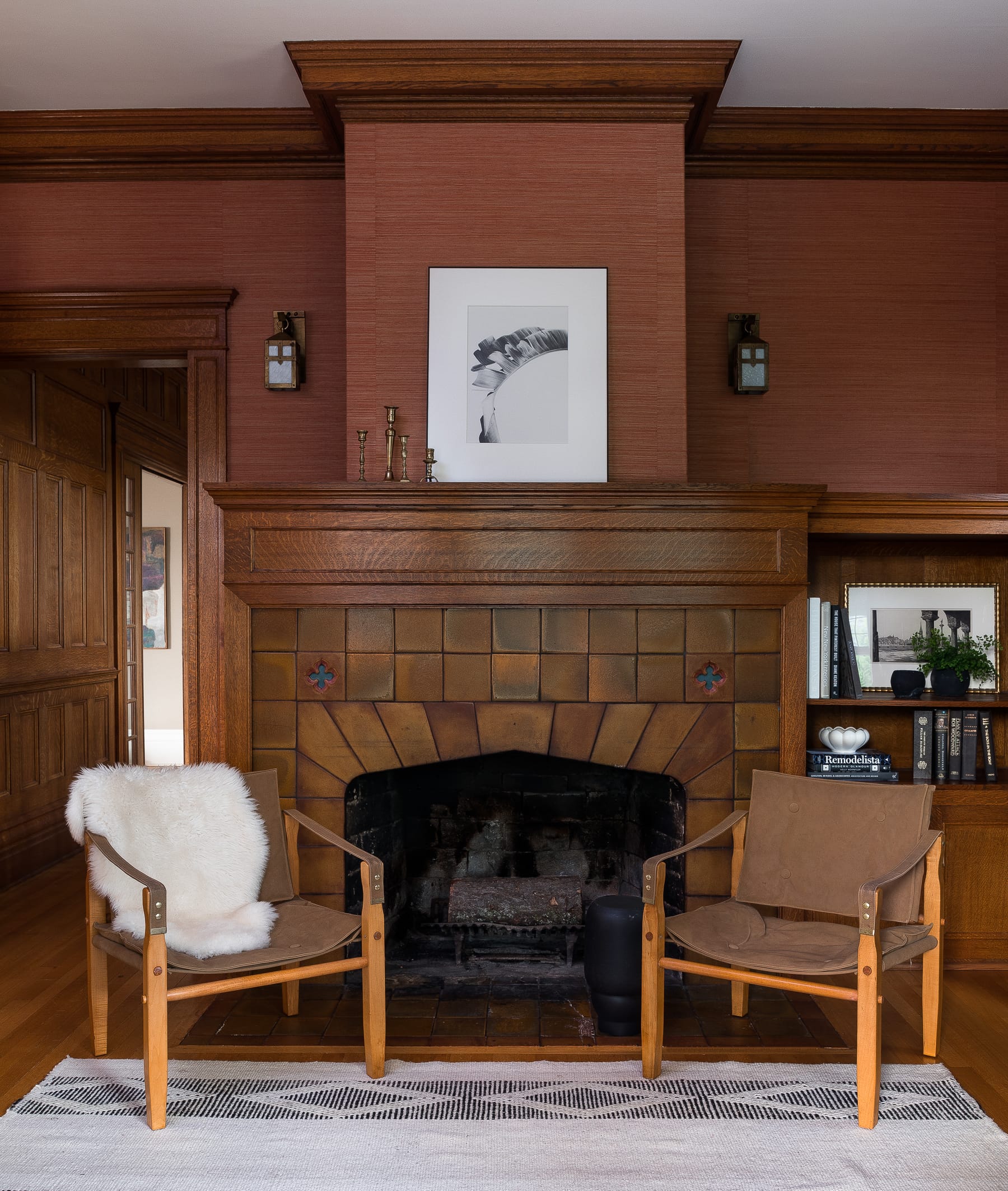 Fireplace against wallpaper in classic Tudor home