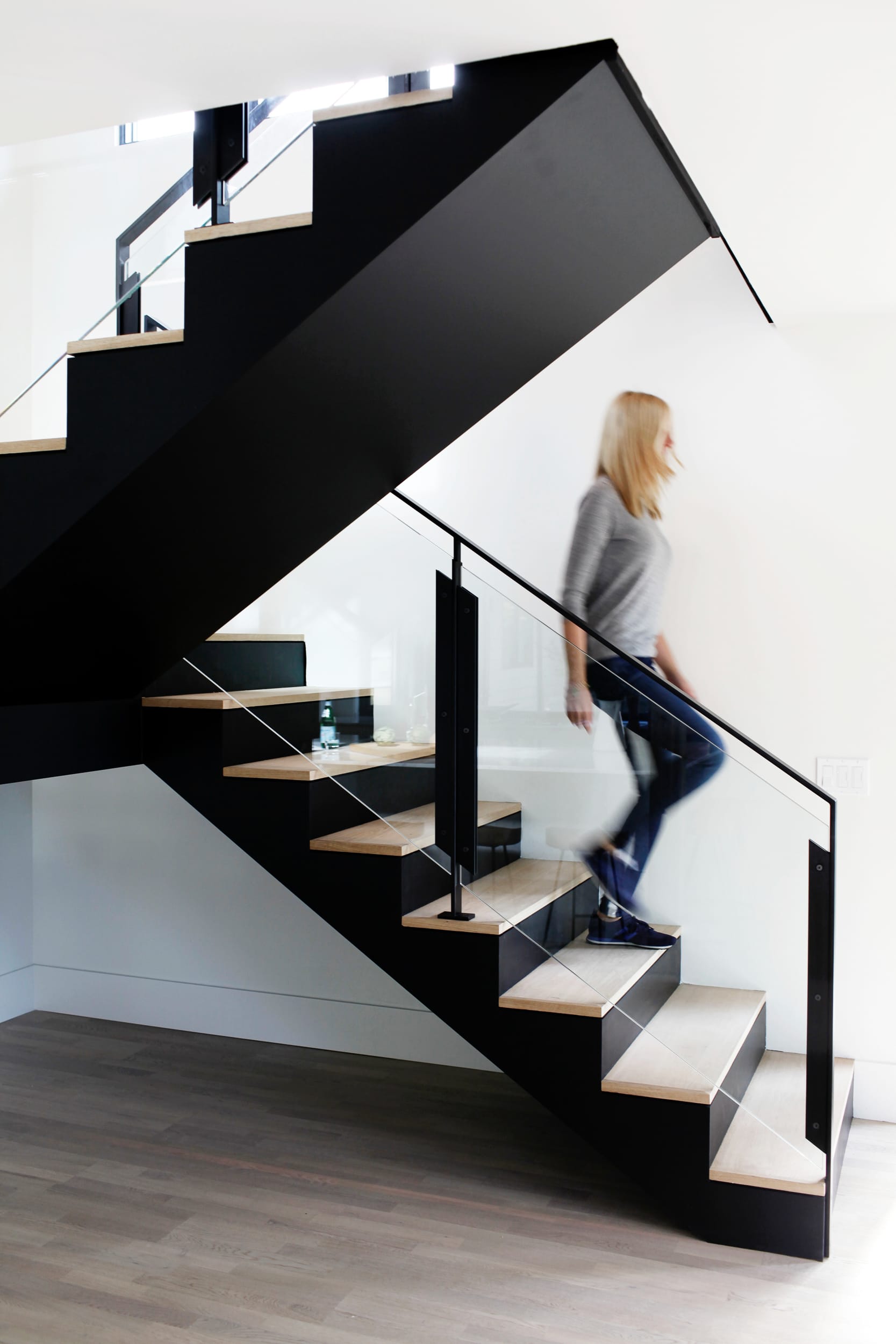 Black stairs with clear railings