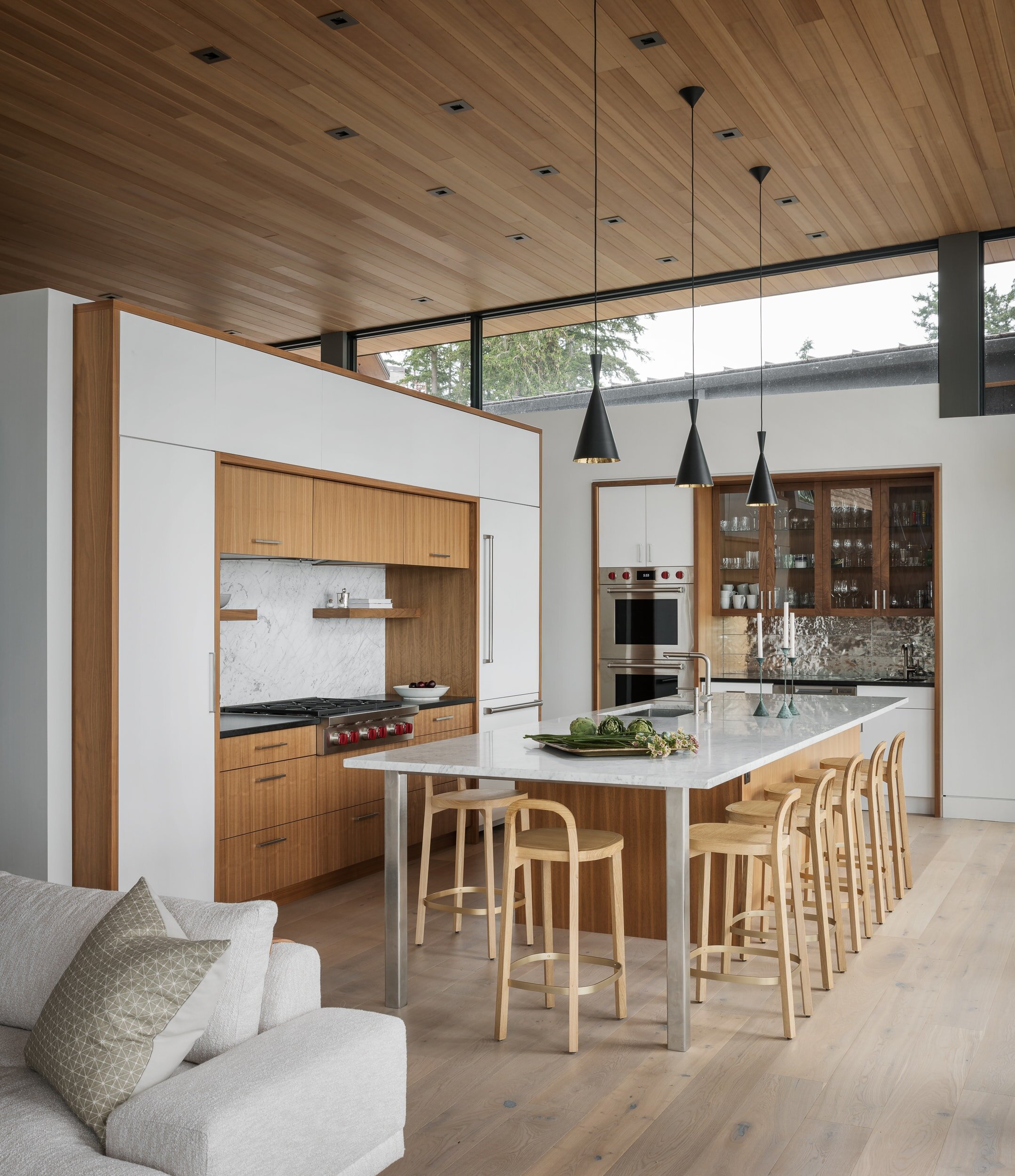 designer space-saving kitchen installed inside open format living area