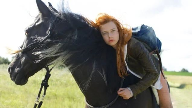 Troubled teenager Mika and untamable black stallion Ostwind in the 2013 movie.