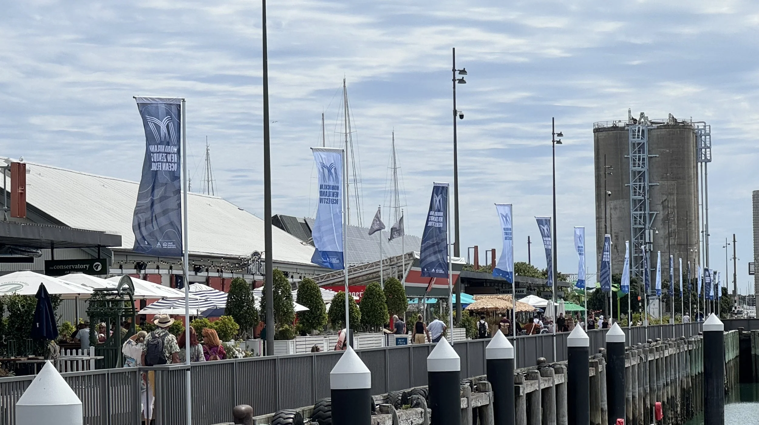Moana Festival 2024 - VEC Fence Swing Arm Flags 2.jpeg