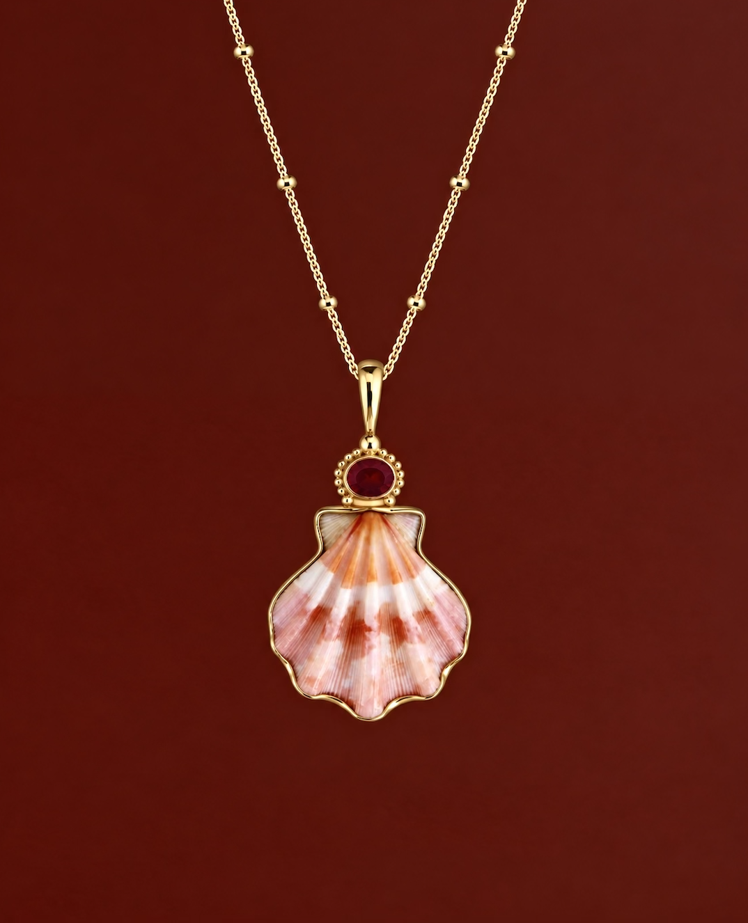Gold Decatopecten and Ruby Pendant