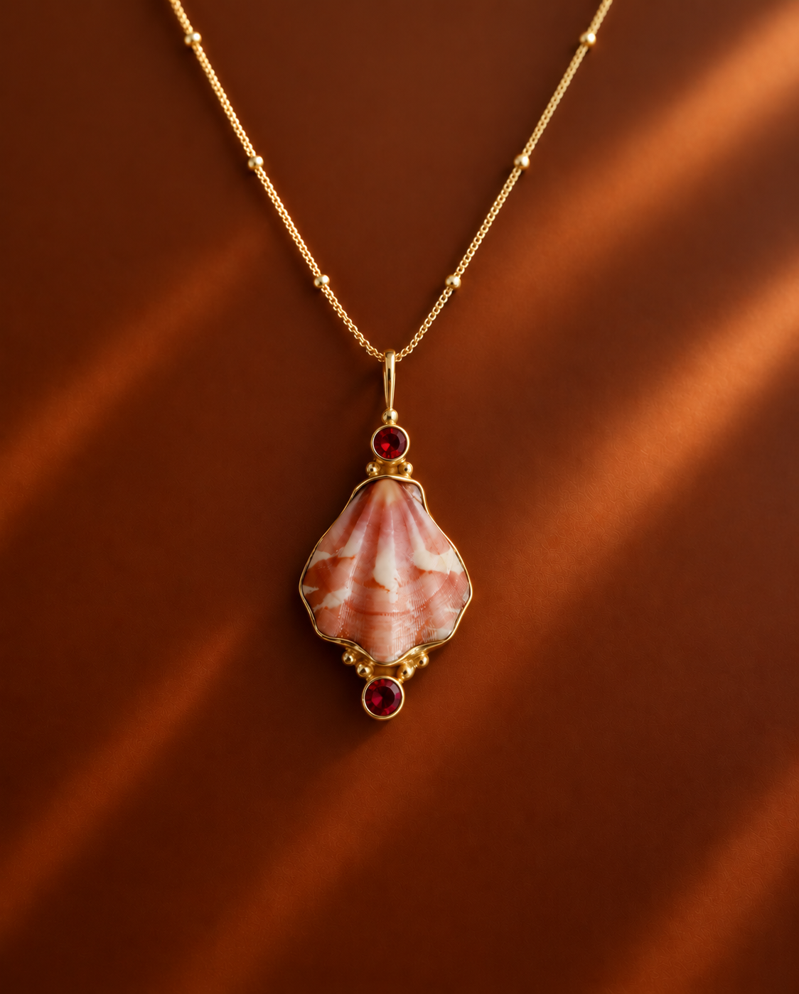 Gold Japanese Decatopecten and Ruby Pendant