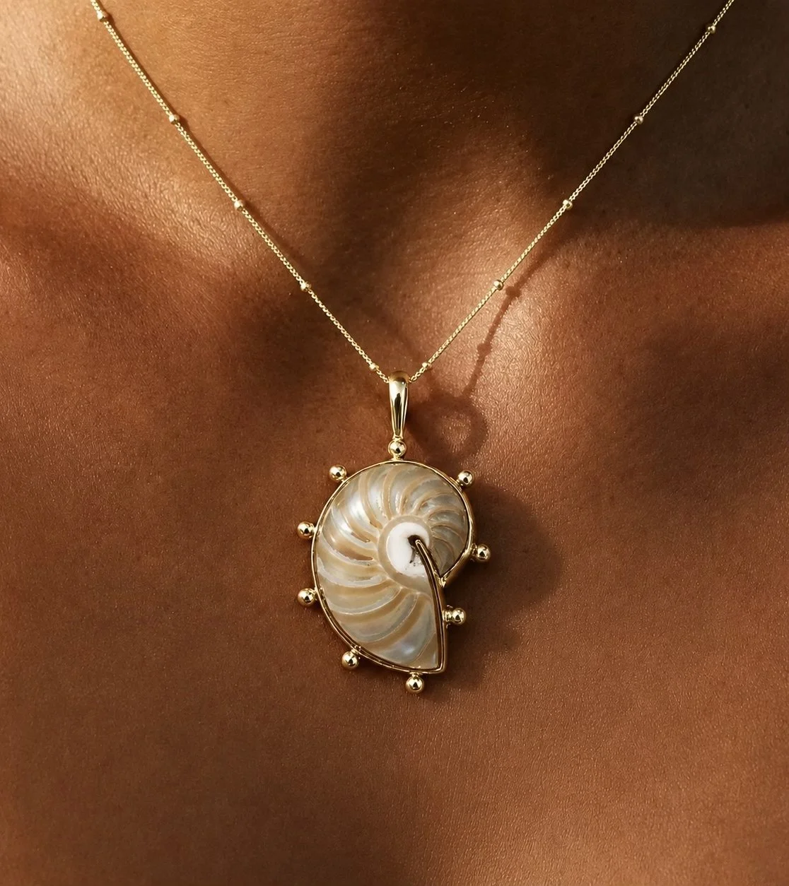 Gold Pearlescent Nautilus Pendant