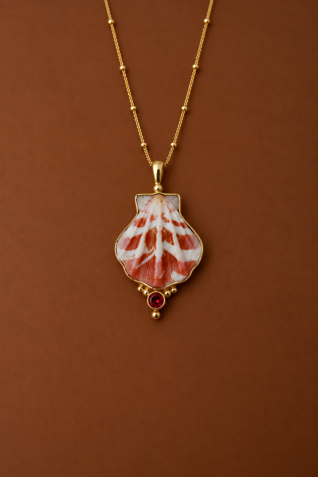 Gold Japanese Decatopecten and Ruby Pendant
