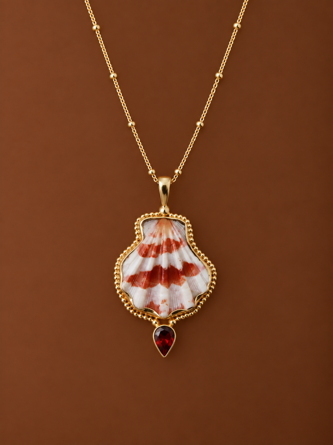 Gold Decatopecten and Garnet Pendant