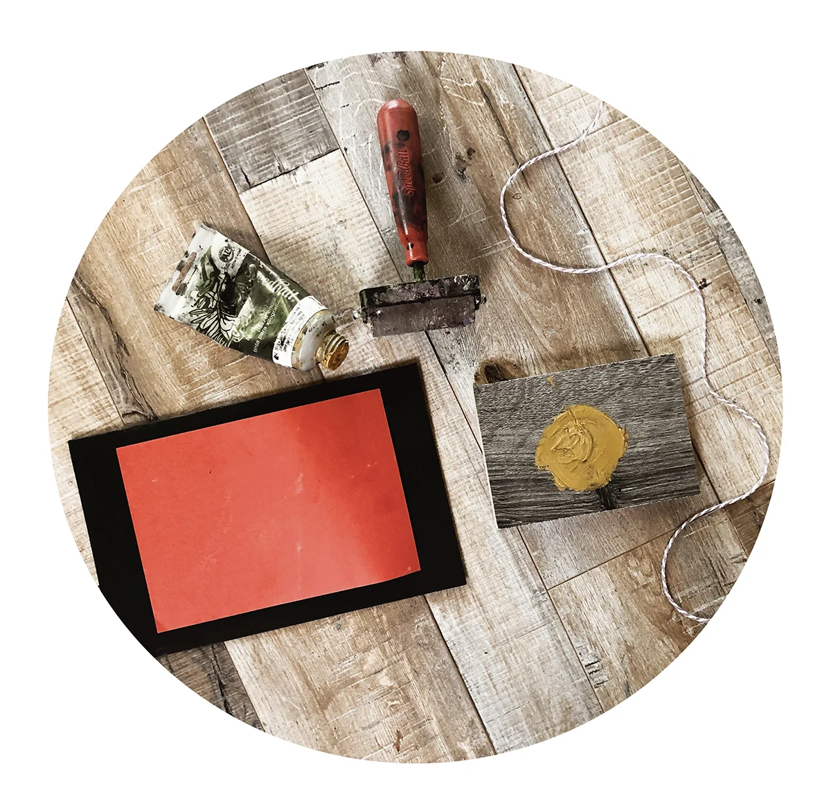 a few helpful materials, brayer to roll the ink, extra paper, string to tie the cards when they are complete, and ink to make the fig prints with