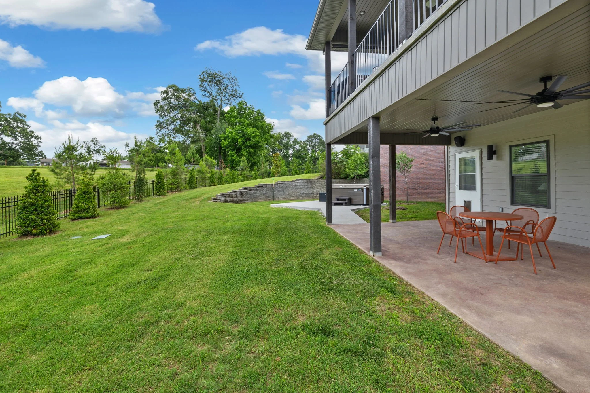 Look out onto the Black Apple Creek Trail left of the patio.