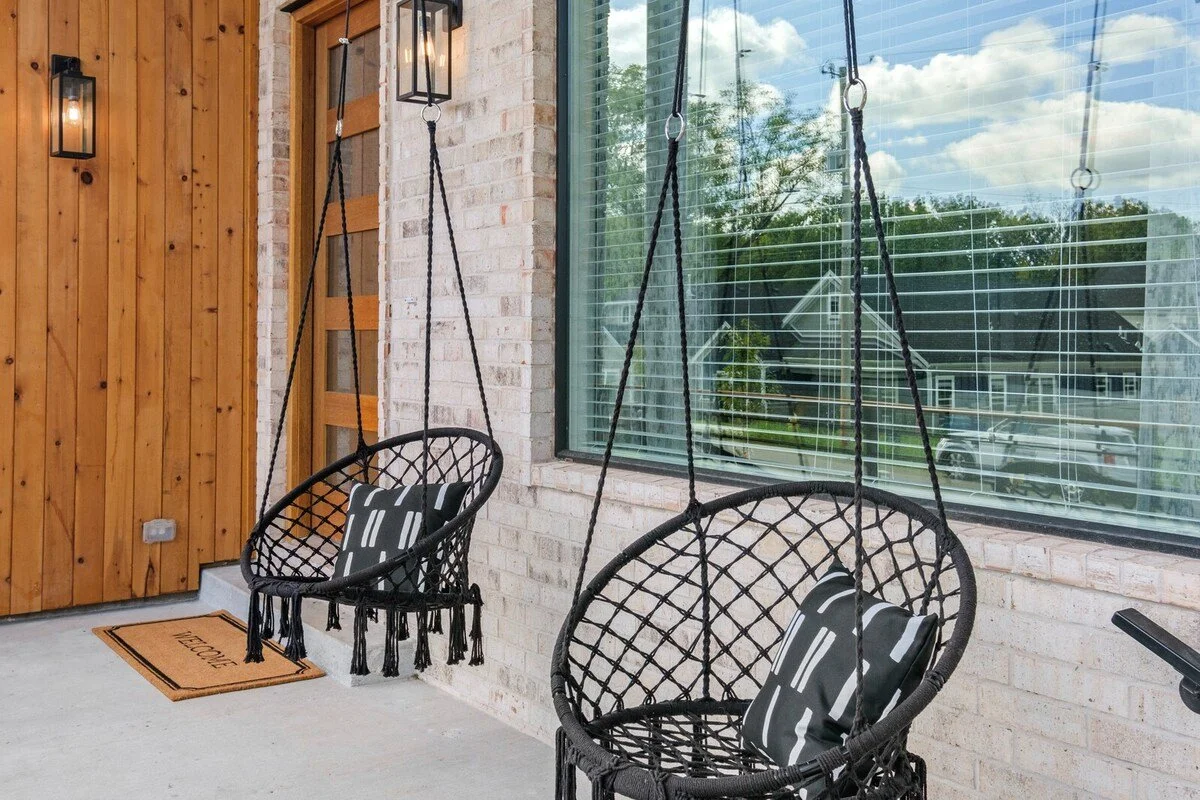Our front porch features two fun hanging swings.