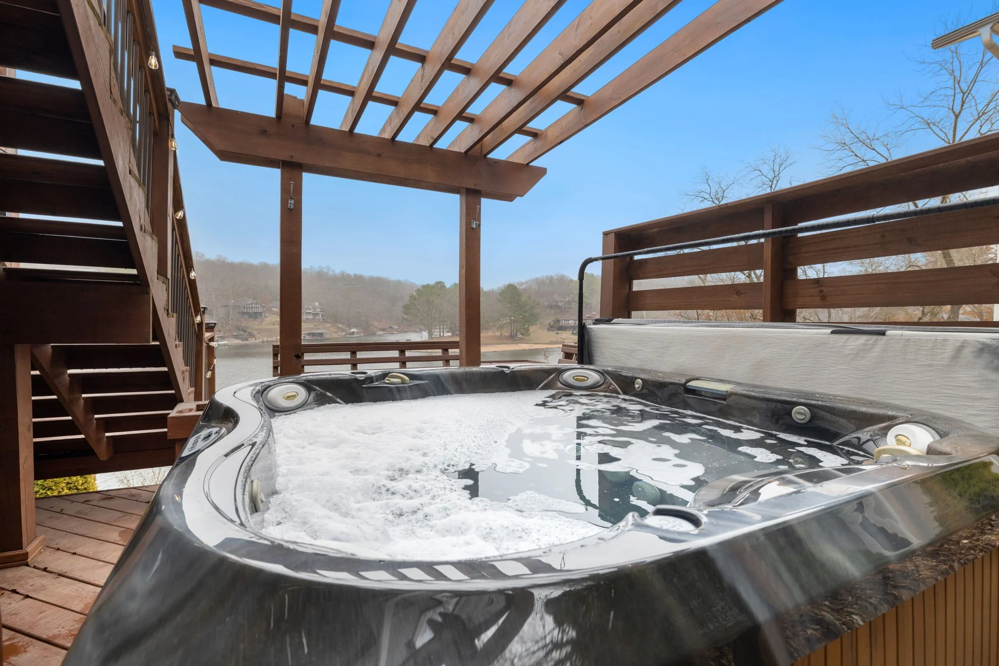 From the porch, walk down a level to the private hot tub. The perfect place to unwind after a day of outdoor adventures!