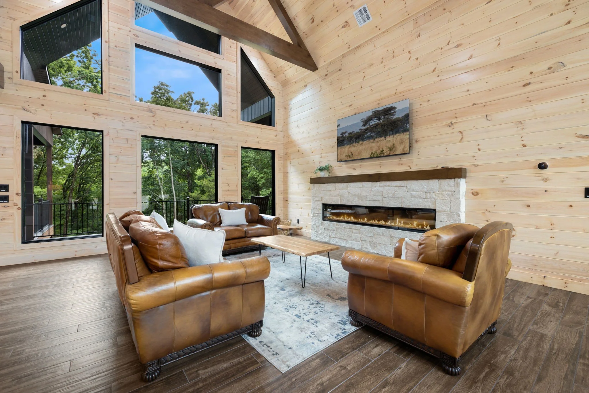 This entire space is flooded with natural light and boasts gorgeous views of the surrounding woods. 