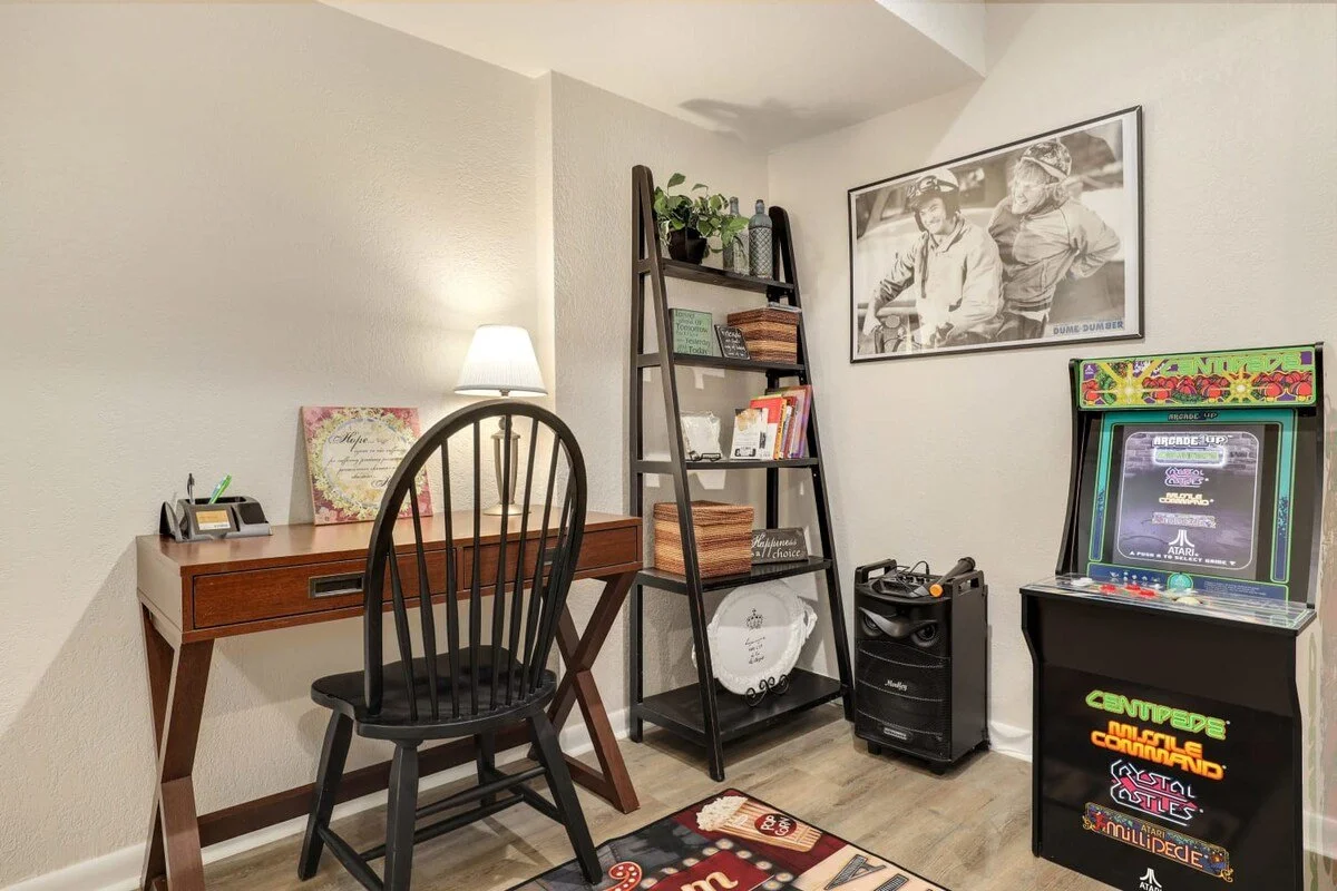 Plus, in the Game Room, find a karaoke machine, an arcade game console,  a desk, and  lots of boardgames! 