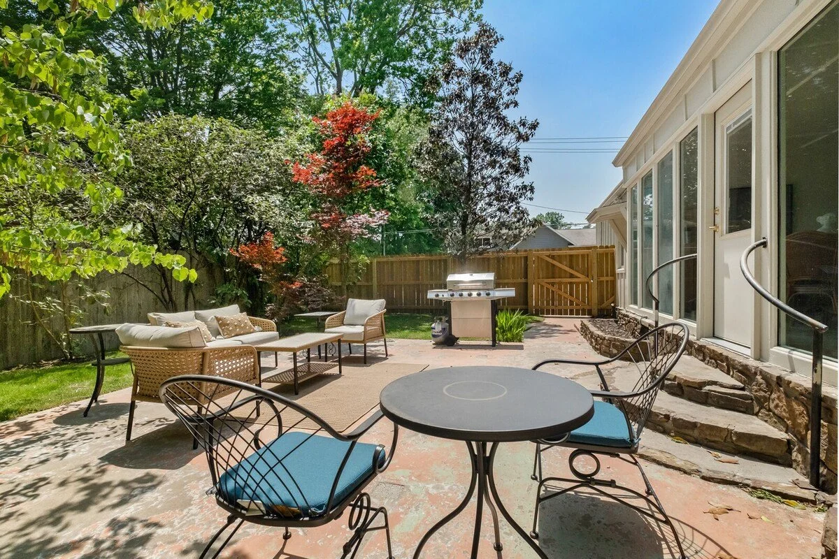 Here, you'll find a BBQ grill, lounge area and two-top dining table.