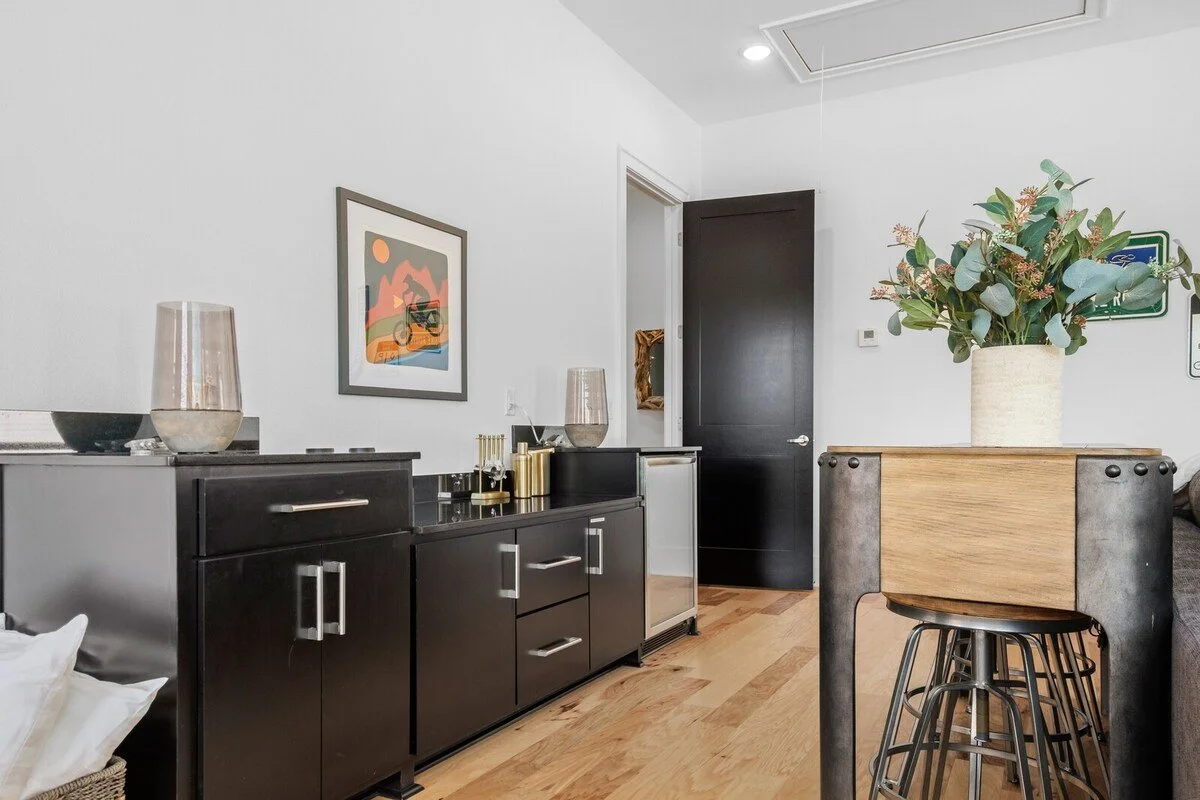 Here, you’ll also find a wet bar complete with a mini fridge, bar seating and all the bar amenities you could ever need. 