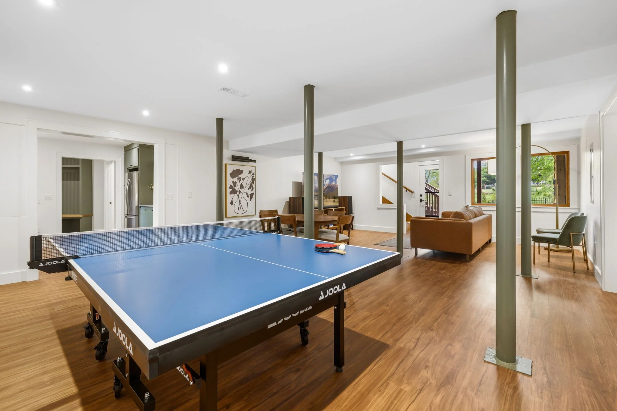 Downstairs is our game room! Enjoy another living space with a ping pong table and board games.