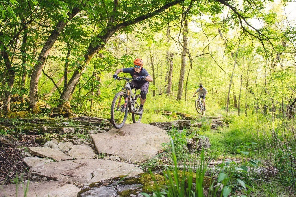 Access to NWA's premier biking, running and walking trails — 0.1 miles from Tunnel Vision MTB Trailhead, visible from The Little Sugar Lofts back patio. • 1 mile from Blowing Springs MTB Trailhead. • 2 miles from Little Sugar MTB Trailhead. • 2 miles