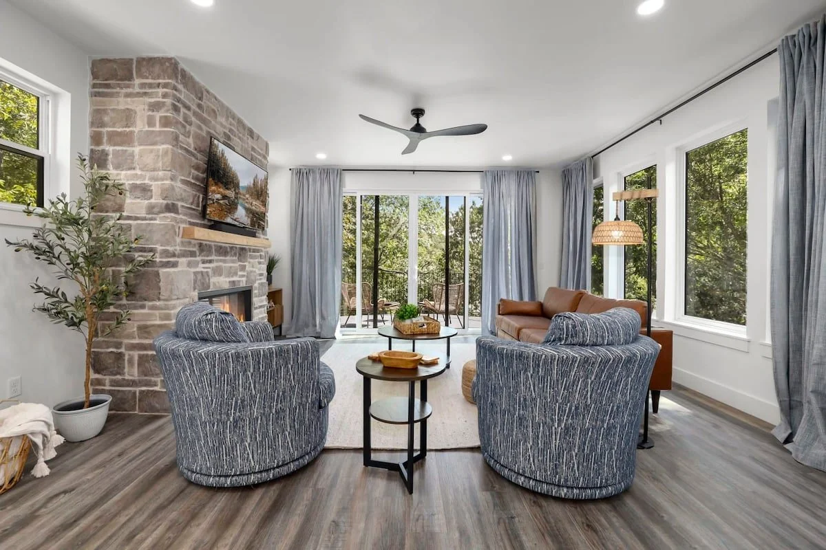 This space features beautiful views, plush seating, a 55-inch Smart TV, and a gas fireplace. 