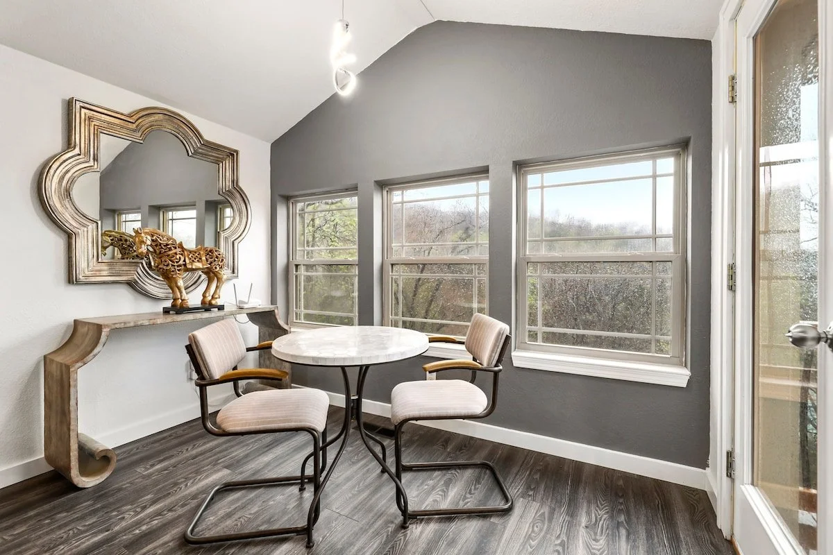 On this level you also have a dining table with seating for two, and access to the top balcony patio with two padded rocking chairs.