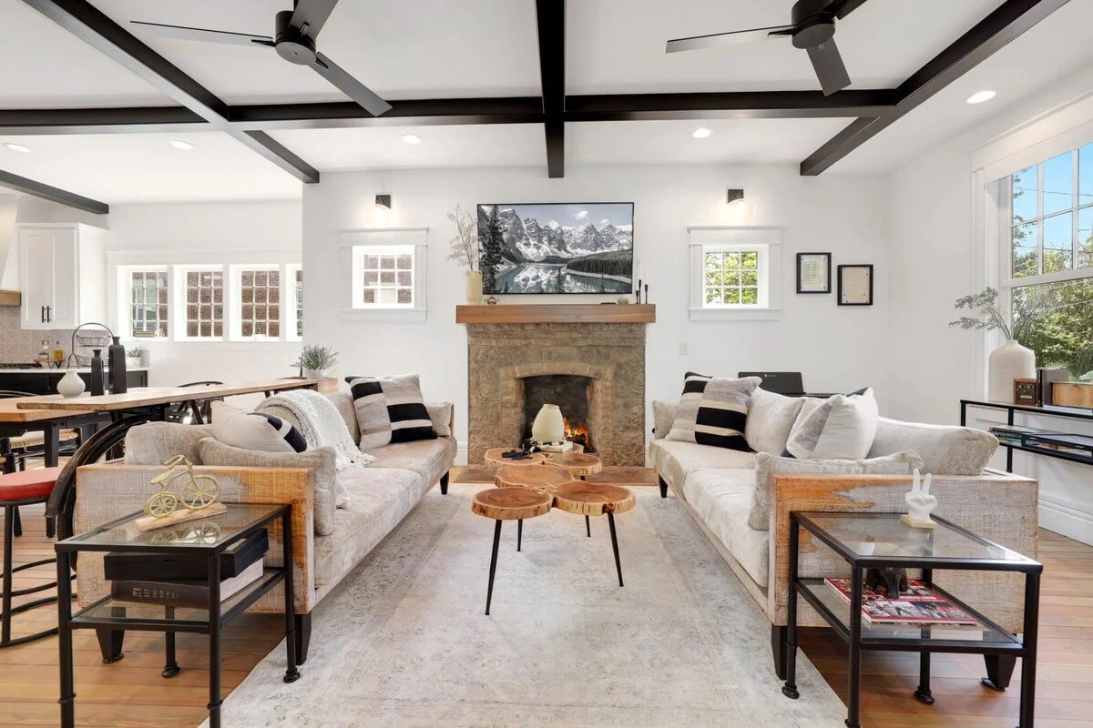 When you enter the front door, you’ll discover a spacious open concept living space with exposed iron beams, modern design and unique vintage touches. 