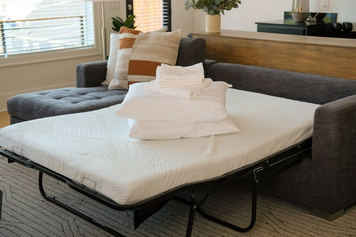 Sleep two extra guests on our Full-size memory foam pullout sofa located within the cozy ‘Article’ sectional in the game room. 