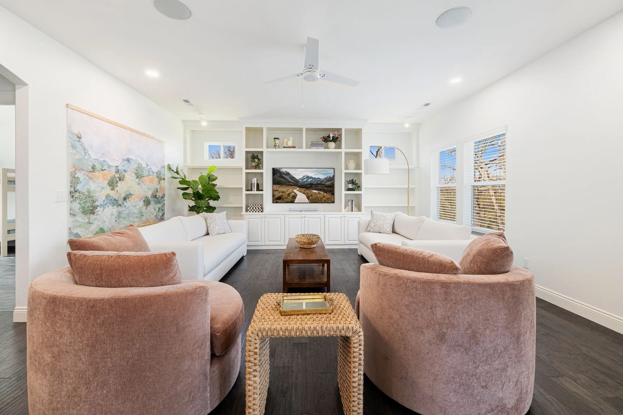 Our main living room is complete with comfy seating, a large Smart TV and Sonos sound system, and huge windows with a gorgeous view. 