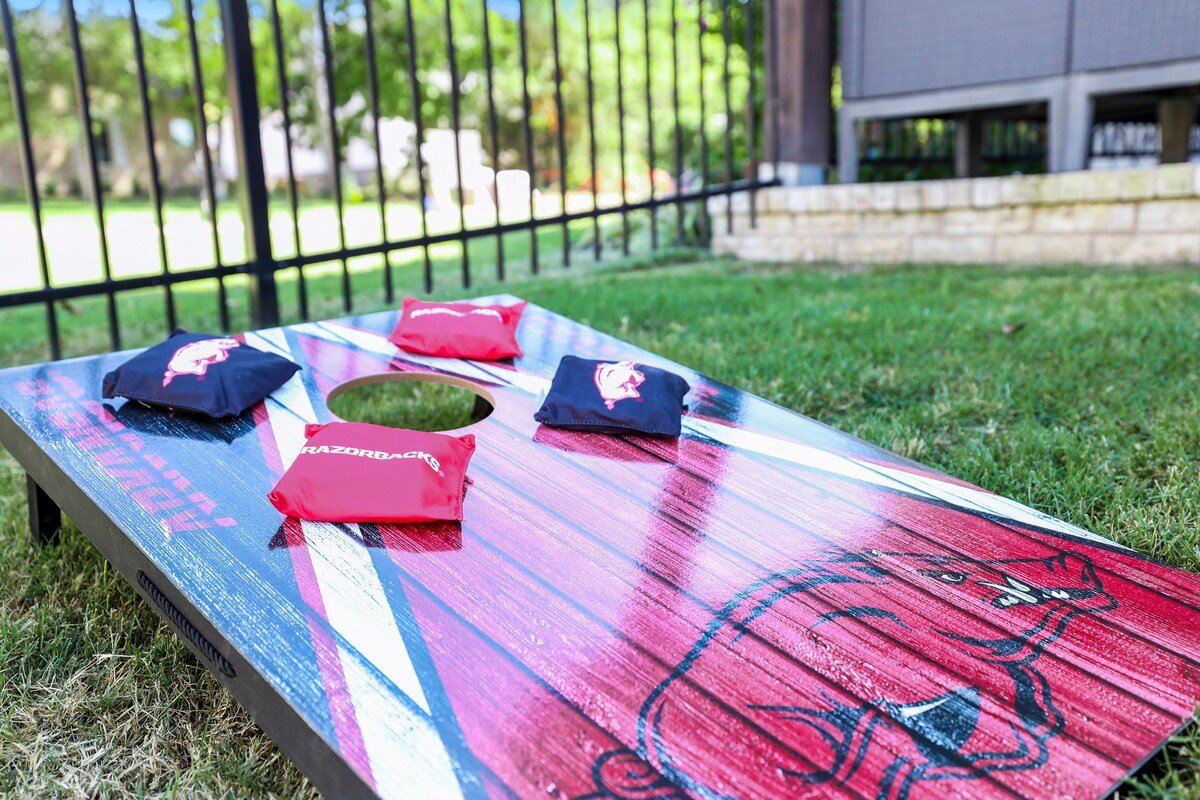 Razorback-themed decor and memorabilia throughout. — Have fun playing with this Hogs themed Baggo.