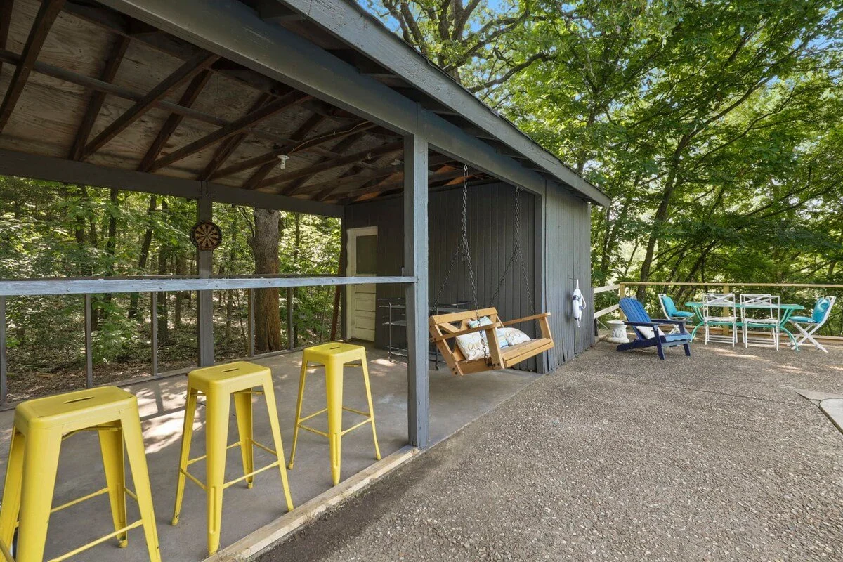 Walk down to the pool hang out spot complete with lounge chairs and a dart board. 