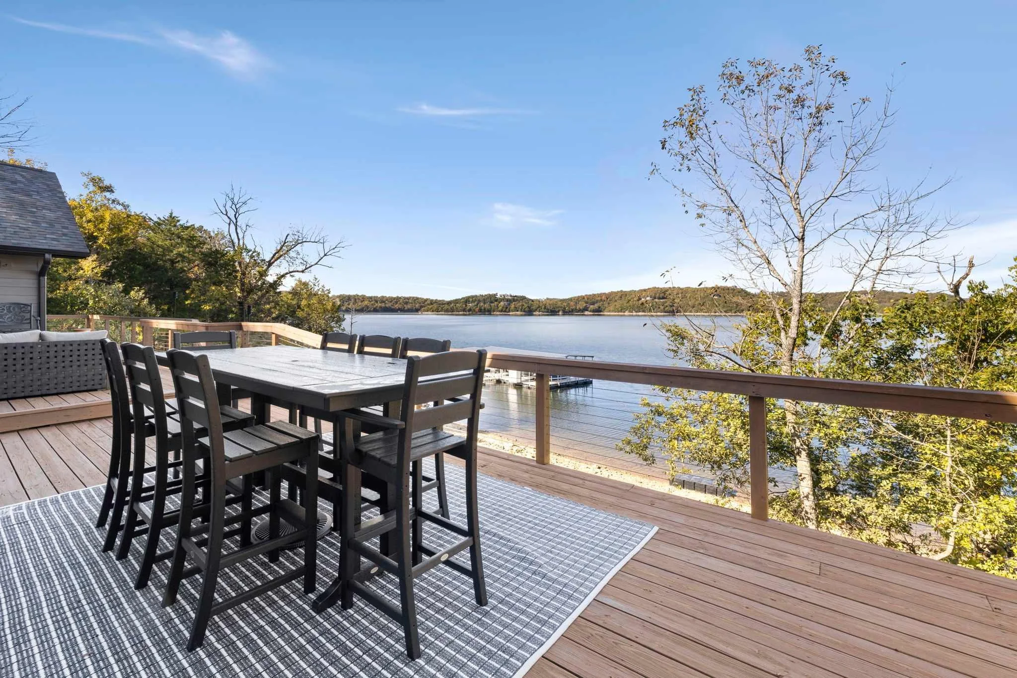 Both living spaces have access to the deck that wraps around the main floor with sweeping lake views.
