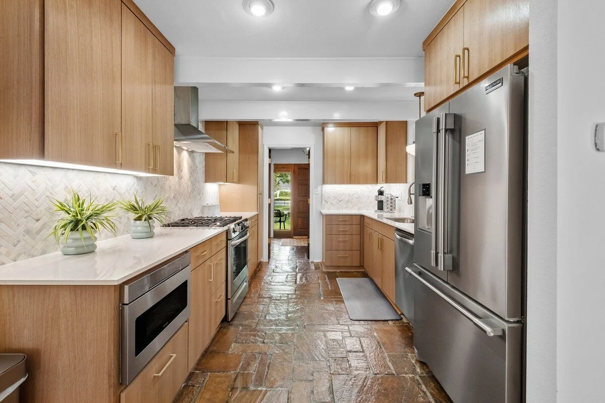 Our kitchen is complete with gorgeous natural stone floors, tons of built-in storage and state-of-the-art amenities.
