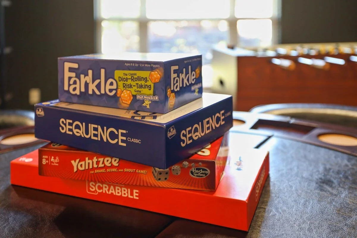 On the shelf, you'll find games like Farkle, Yahtzee, Scrabble, Sequence and cards.