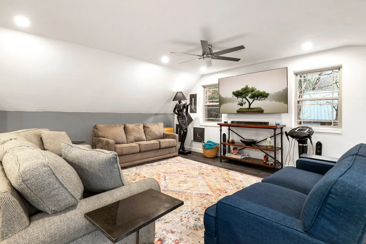 Up here you'll see three couches, karaoke machine, telescope, and 75-inch LG Smart TV with Apple TV and Sound Bar. 