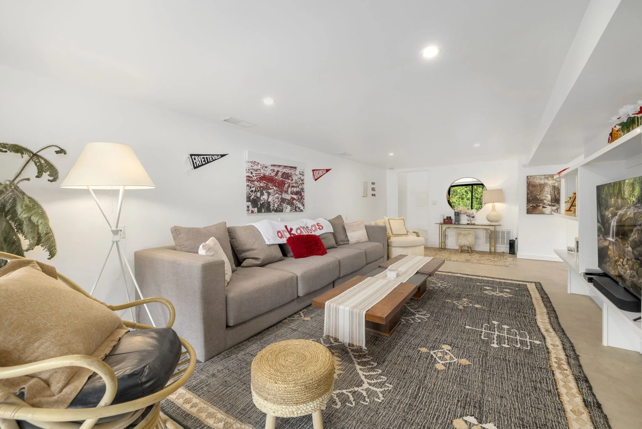 Second living space with additional seating, a large Smart TV, and a karaoke machine!