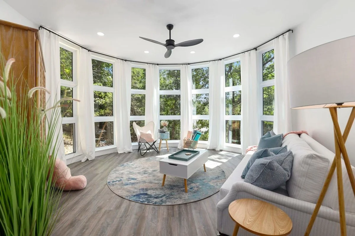 Also, on the 2nd floor is a bedroom/yoga studio that has floor to ceiling windows, yoga mats, and a couch that pulls out into a Queen size bed.